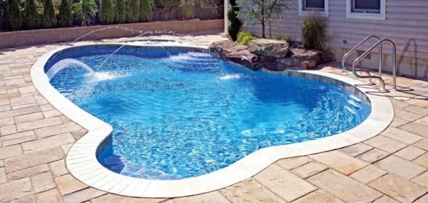 One of the most exciting decisions you will make when building a new swimming pool is what type of pool finishes to incorporate.

Pool finishes not only add color and texture to your pool, they protect the concrete from wear and can also help prevent water seepage.

Choosing a pool finish may seem overwhelming initially, due to the many options, colors, and styles. Below, we will offer you some guidance on different pool finish types, to help you narrow the field.

Plaster Pool Finishes
plaster pool finish

Plaster is a mix of cement, aggregate, and water. Plaster pool finishes can be mixed with the color of your choice and can provide an iconic yet simplistic appearance. A plaster pool finish is typically the least expensive option out of all pool finishes.

Plaster pool finishes can be rough to the touch and can scrape skin. Plaster is also algae-friendly, so additional pool maintenance may be required to keep algae at bay.

Plaster can crack, stain, and scale, especially if your water chemistry is not maintained at ideal levels.

Plaster is the least durable of the pool interior finishes available. It will need replacement in approximately 5-10 years.

Quartz Aggregate Pool Finishes
Esthetically pleasing, quartz pool finishes are a blend of plaster, silica, and quartz aggregate. The aggregate is mechanically tumbled to create rounded shapes embedded into the mix.

Quartz pool finishes have beautifully colored ceramic pigments bonded onto their surfaces, creating a dazzling effect.

Quartz has a high level of mineral hardness and is resistant to scratches or chipping. It is non-porous and stain-resistant. Quartz is resilient against varying chemical levels make it ideal for pool owners with hard water or persistent chemical fluctuations.

A quartz pool finish will generally last between 10 to 15 years.

Pebble Pool Finishes
Choosing a Swimming Pool Finish – The Best Pool Finishes 1Pebble pool finishes are comprised of a mix of smooth pebbles, stone aggregate, and cement. This aggregate is collected from riverbeds and beaches.

Quality pebble surfaces offer a textured feel and are slip-resistant. However, if you prefer a smoother texture, mini pebble, which utilizes a smaller aggregate, can be the ideal option.

Pebble pool finishes have a natural appearance that blends well with outdoor entertainment elements such as stone fire pits and rock waterfalls. Pebble pool finishes are available in a spectrum of colors that can coordinate with your existing backyard theme.

This is the most durable of the pool finishes, as pebble can last over 25 years. Initial costs are higher than other pool finishes, but pebble finishes have a much longer lifespan.

Tile Pool Finishes
pool finishes - tile

Tile pool finishes are constructed of porcelain, stone, or glass. Tile is available in a wide variety of textures, and infinite colors. Due to the array of textures, colors, and styles, tile can be selected to coordinate with any surrounding landscape design.

Tile finishes are stain-resistant, and with proper pool maintenance, the easiest to clean. While tile is a durable choice, tile can chip or crack, which can create sharp edges, and can distract from your pool’s beauty.

The cost and longevity of tile pool finishes vary greatly, depending on the material chosen.

All the pool finishes above can provide years of enjoyment and can enhance the beauty of your new swimming pool.

If you need assistance choosing the perfect pool materials or you are ready to build a pool and would like a free quote on your project, contact Premier Pools & Spas today utilizing the form below.