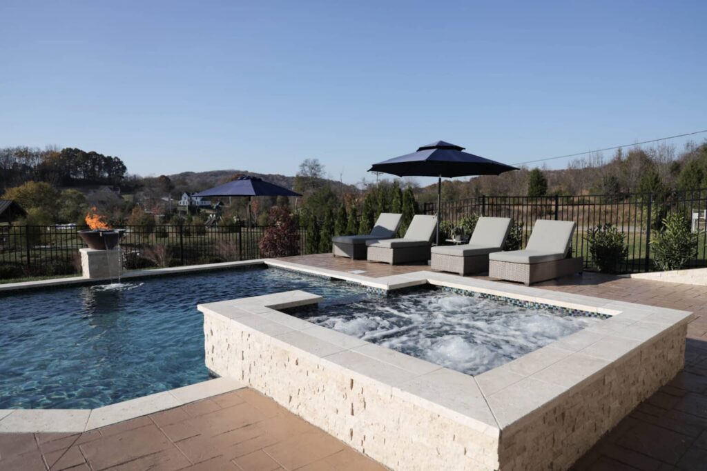 Luxury pool with hot tub and loungers