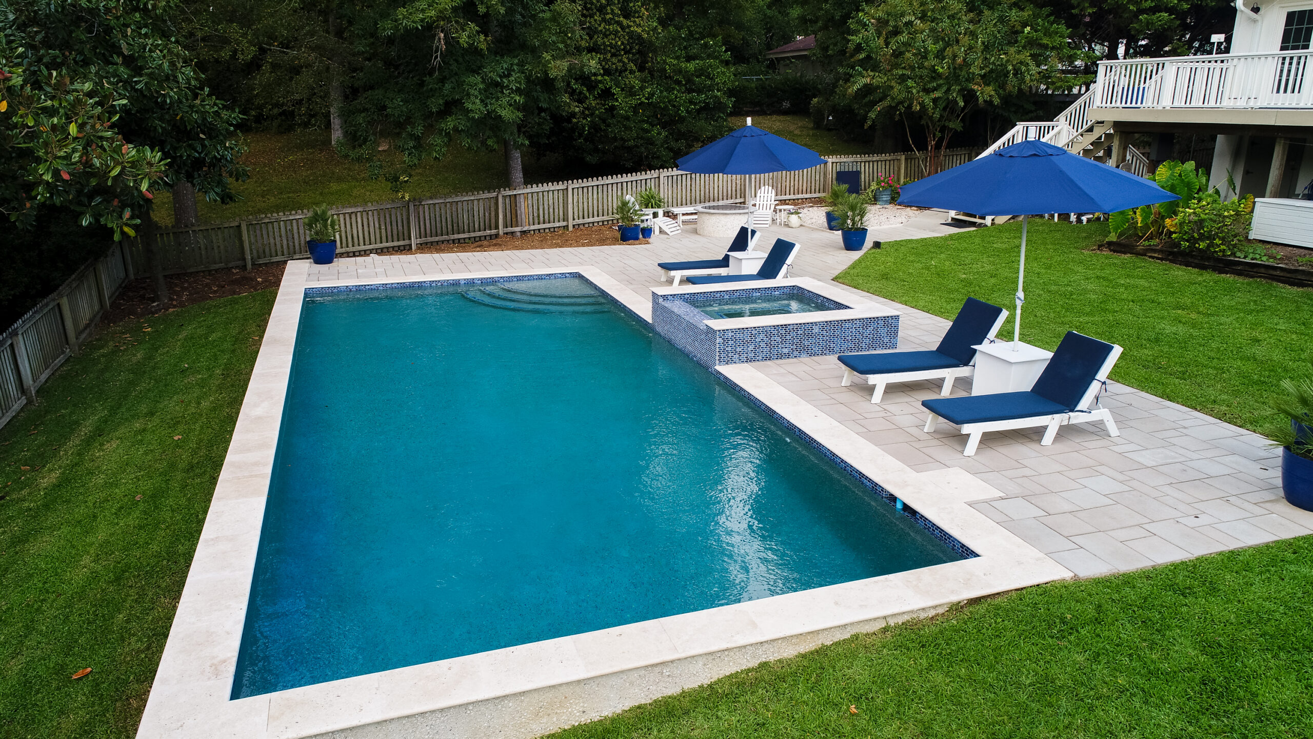 Backyard pool with lounge chairs