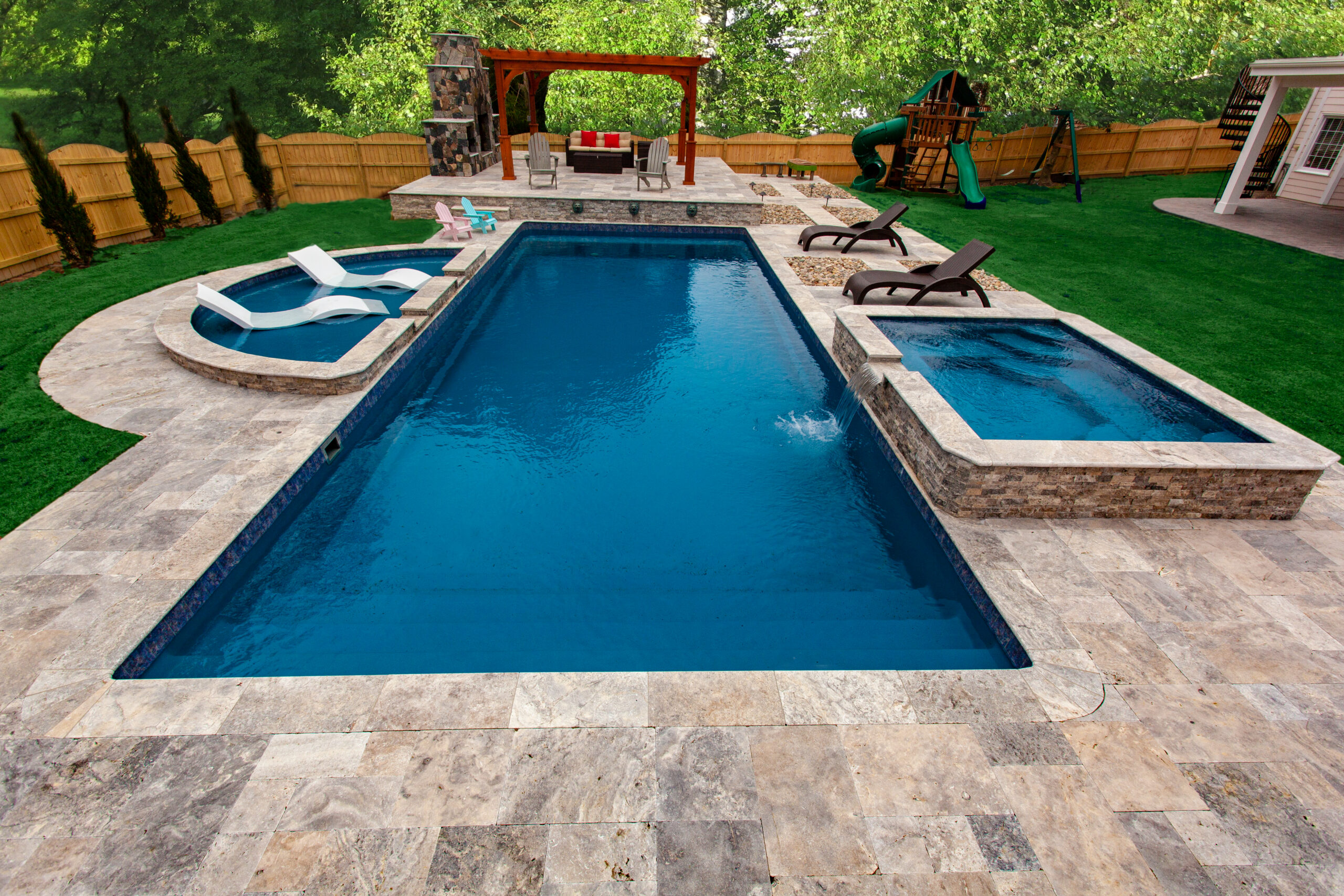 Backyard pool with lounge area.