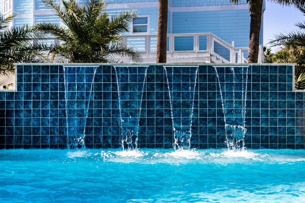 Waterfall feature in a swimming pool