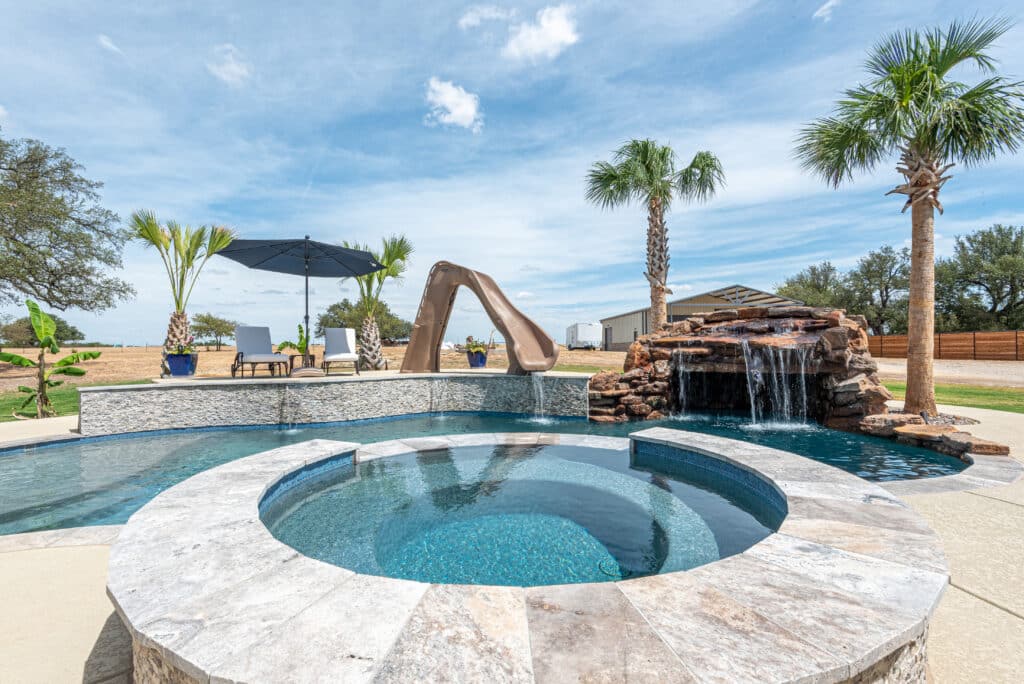 Luxury pool with waterfall and slide