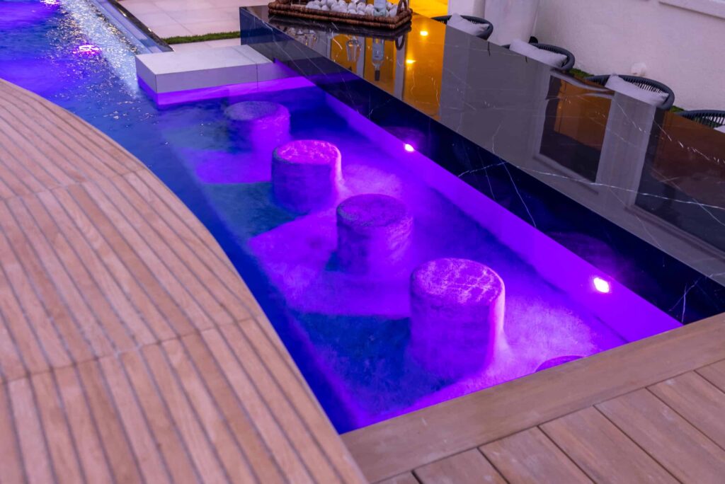 Illuminated pool with purple accents