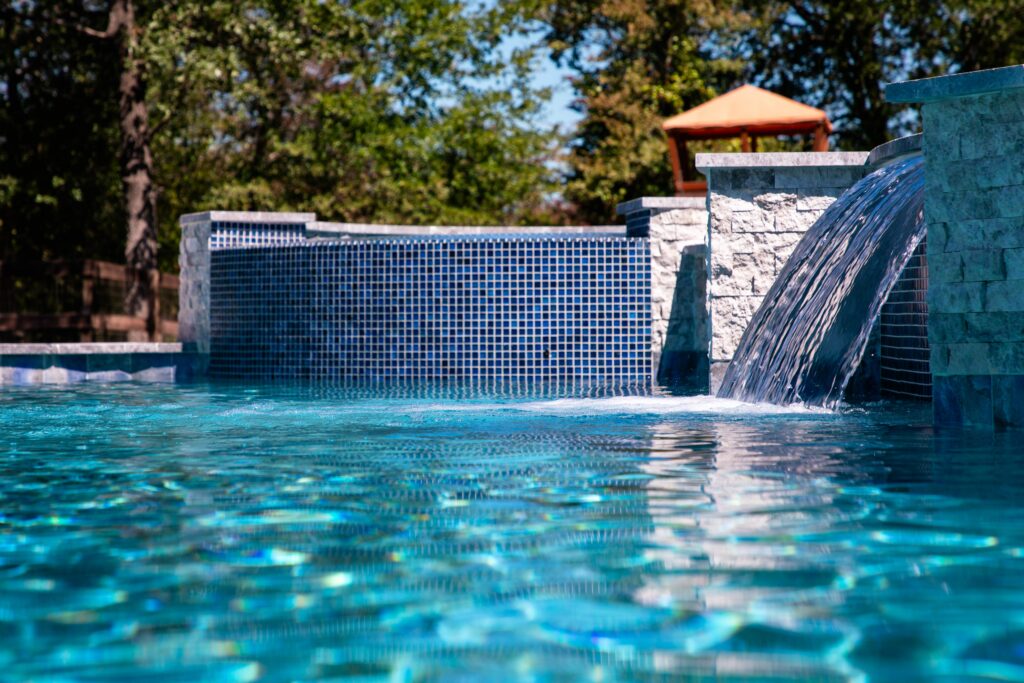 Clear pool with waterfall feature.