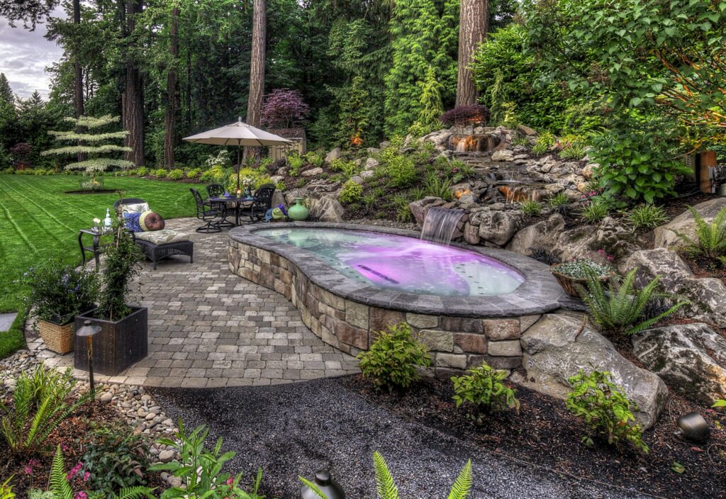 Serene backyard spa with waterfall