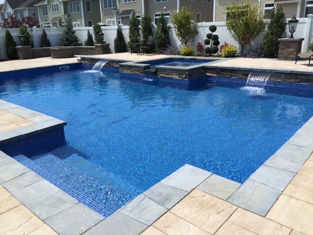 Beautiful blue swimming pool with waterfall