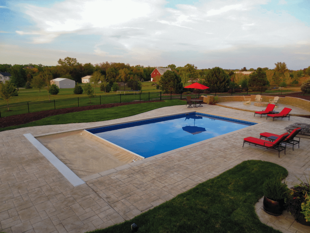 Elegant pool with lounge chairs and umbrella