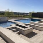 Modern pool with surrounding concrete features