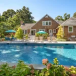 Beautiful backyard pool with lounge chairs