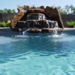 Waterfall feature in a swimming pool
