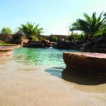 Tropical pool with rock formations.