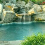 Serene pool with waterfall and flowers