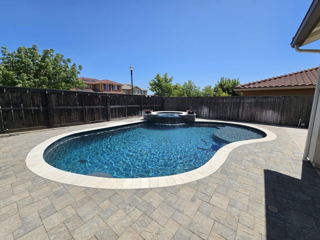 Clear pool surrounded by wooden fence