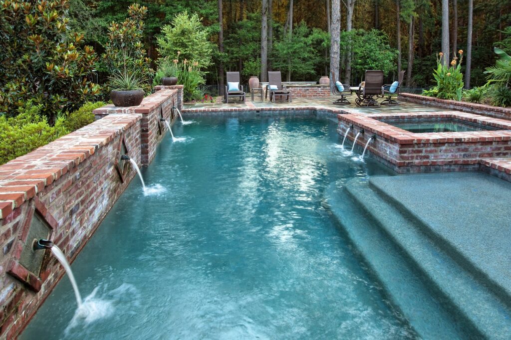 Elegant pool with brick accents.