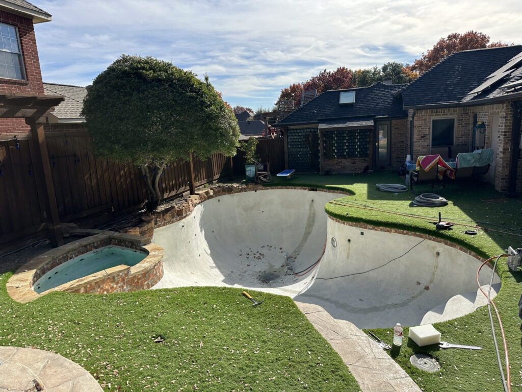 Empty pool in backyard under renovation