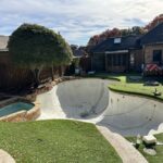 Empty pool in backyard under renovation