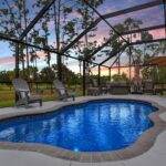 Fiberglass pool area with sunset view