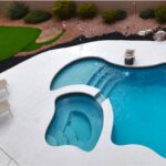 Pool and golf area in backyard