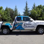 White truck with premier pool service branding